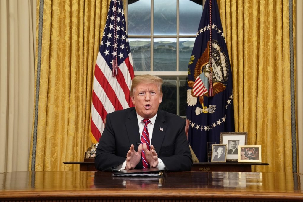 Government Shutdown Trump President Donald Trump speaks from the Oval Office of the White House as he gives a prime-time address about border security Tuesday, Jan. 8, 2018, in Washington. (Carlos Barria/Pool Photo via AP)