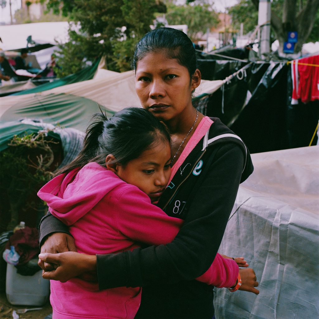 Karen Paz hugs her daughter, Liliana Saray, 9. They are from San Pedro Sula, Honduras. “I feel free; I feel different,” Paz said. “I don’t have someone who imposes his views and his ways on me. I am not scared someone will come and attack me, like I used to be.” Karen Paz hugs her daughter, Liliana Saray, 9. They are from San Pedro Sula, Honduras.