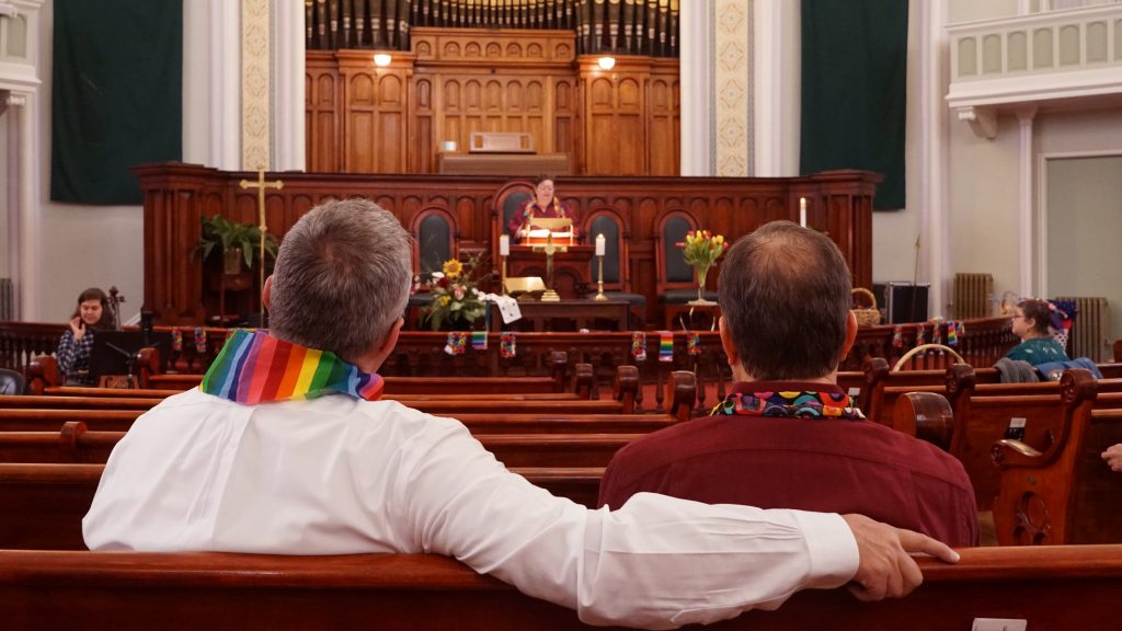 Daron Smith, left, and his husband, Chris Finley, right, worship at a Sunday morning service at Lafayette Park United Methodist Church in St. Louis, Mo. Smith, a lifelong United Methodist, said he feels hopeful ahead of a vote on LGBTQ ordination and same-sex weddings in the church. Daron Smith, (left), and his husband, Chris Finley, (right), worship at a Sunday morning service at Lafayette Park United Methodist Church in St. Louis, Mo. Smith, a lifelong United Methodist, said he feels hopeful ahead of a vote on LGBTQ ordination and same-sex weddings in the church. (Shahla Farzan/St. Louis Public Radio)