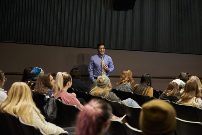 Motivational speaker and HIV/AIDS educator Scott Fried goes around the room  and personally introduces himself to all who attended. (Natalie Piserchio for WHYY)