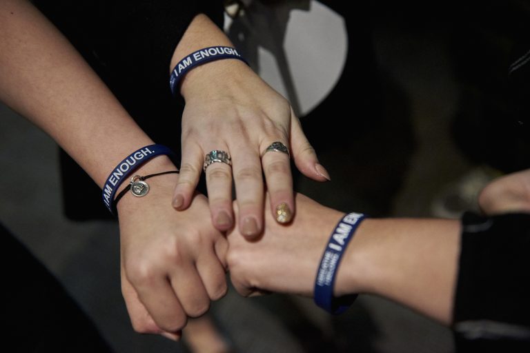 Students who attended Scott Fried's program wear bracelets given to them by Fried that read, 