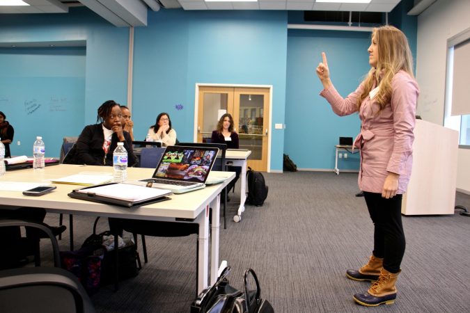 Maria Campbell of CWC Wellness delivers her pitch for a program that gives employers in the food industry a way to encourage their employees to develop healthier habits. (Emma Lee/WHYY)