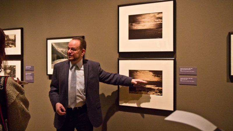 Collector Michael Mattis explains the secret behind the perfectly exposed skiers of Gustave Le Gray’s landscape photography. (Kimberly Paynter?WHYY)