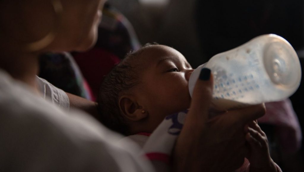 20190128_NextCity_Prison_Breast_Feeding_Delivery_193_1400_721_80 Theresa Reid feeds her five-month-old niece, Ummayyah, a bottle of breast milk that was pumped by Ummayyah's mother, Cierra Jackson, who is serving a 6-to-23-month sentence at Riverside Correctional Facility, in Philadelphia. (Kriston Jae Bethel/Next City)