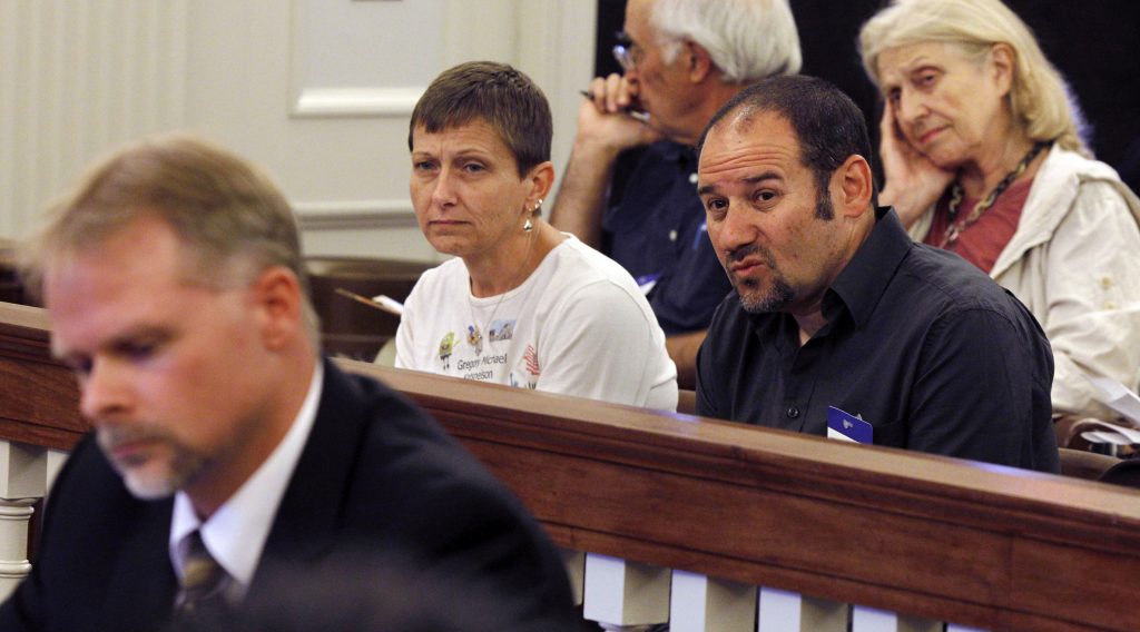 Cathy Katsnelson, Mark Katsnelson Cathy Katsnelson, second left, and Mark Katsnelson, second right, listen to