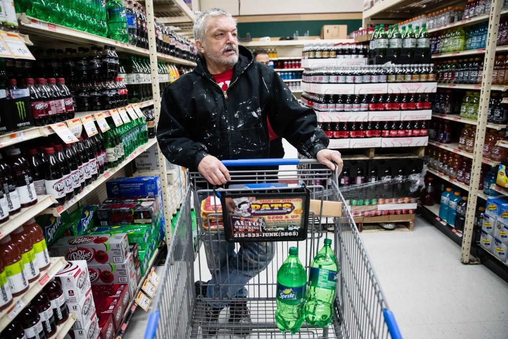 Soda Tax Philadelphia In this March 16, 2017 photo, customer Fran Flanagan is interviewed as he shops for soda at the IGA supermarket in the Port Richmond neighborhood of Philadelphia. The city's tax on sweetened drinks remains controversial two years later. (AP Photo/Matt Rourke)