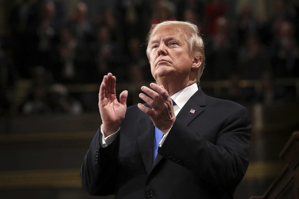 APTOPIX State of Union President Donald Trump claps during the State of the Union address in the House chamber of the U.S. Capitol to a joint session of Congress Tuesday, Jan. 30, 2018 in Washington. (Win McNamee/Pool via AP)