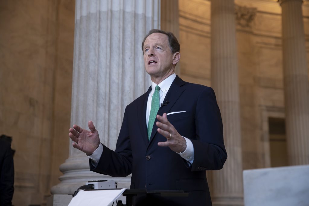 Sen. Pat Toomey, R-Pa., discusses President Donald Trump's revamped North American trade agreement with Canada and Mexico during a television news interview on Capitol Hill in Washington, Tuesday, Oct. 2, 2018. (J. Scott Applewhite/AP Photo)