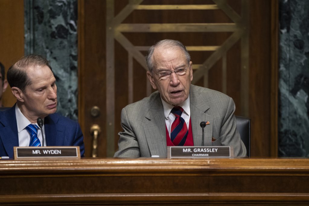 Chuck Grassley, Ron Wyden Sen. Chuck Grassley, R-Iowa, (center), chairman of the Senate Finance Committee, is joined at left by Sen. Ron Wyden, D-Ore., the ranking member, at a hearing on the high price of prescription drugs, on Capitol Hill in Washington, Tuesday, Jan. 29, 2019. (J. Scott Applewhite/AP Photo)