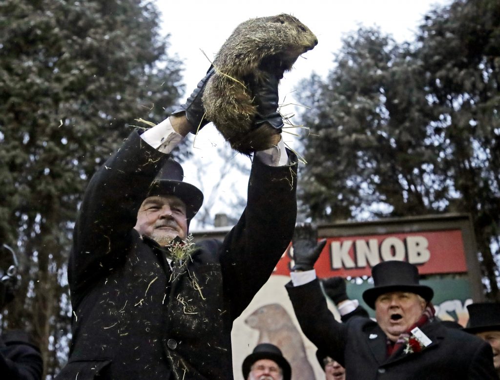 John Griffiths, John Griffiths Al Dereume Groundhog Club co-handler John Griffiths, (left), holds Punxsutawney Phil, the weather prognosticating groundhog, during the 133rd celebration of Groundhog Day on Gobbler's Knob in Punxsutawney, Pa. Saturday, Feb. 2, 2019. Phil's handlers said that the groundhog has forecast an early spring. (Gene J. Puskar/AP Photo)