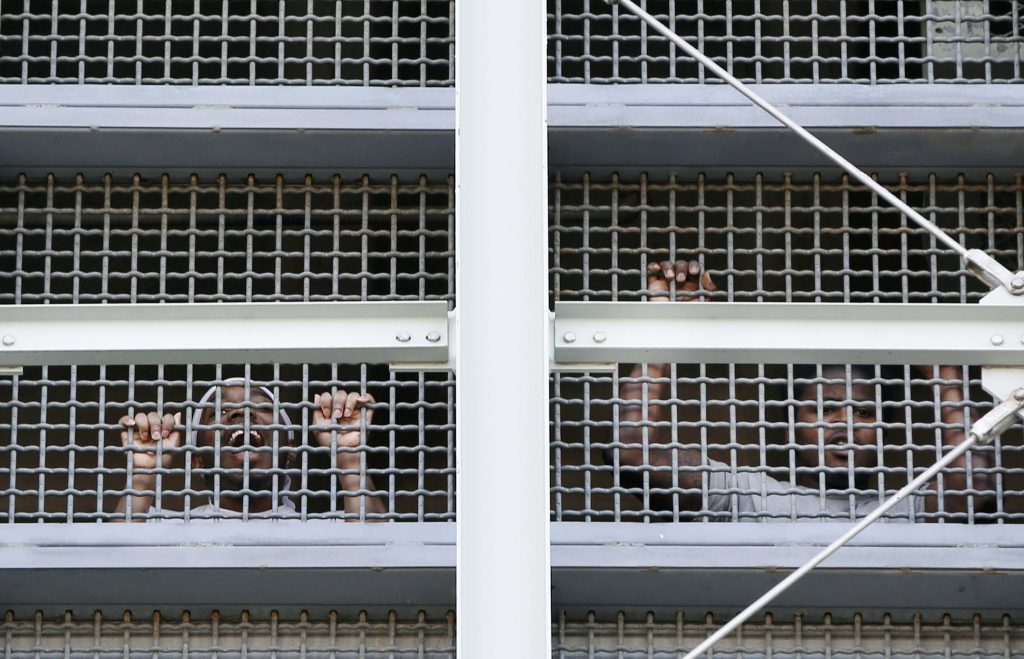 Prisoners call out to protesters and family members gathers outside the Metropolitan Detention Center, a federal prison where prisoners have been without heat, hot water, electricity and proper sanitation due to an electrical failure since earlier in the week, Sunday, Feb. 3, 2019, in the Brooklyn borough of New York. (Kathy Willens/AP Photo)