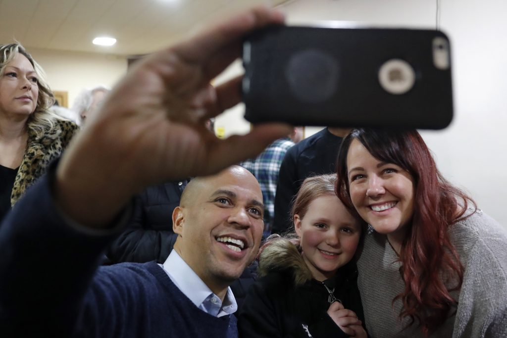 Cory Booker U.S. Sen. Cory Booker, D-N.J., poses for a photo with Alyssa Benson, of Mason City, Iowa, (right), and her daughter Jersey, (center), during a meet and greet with local residents at the First Congregational United Church of Christ, Friday, Feb. 8, 2019, in Mason City, Iowa. (Charlie Neibergall/AP Photo)