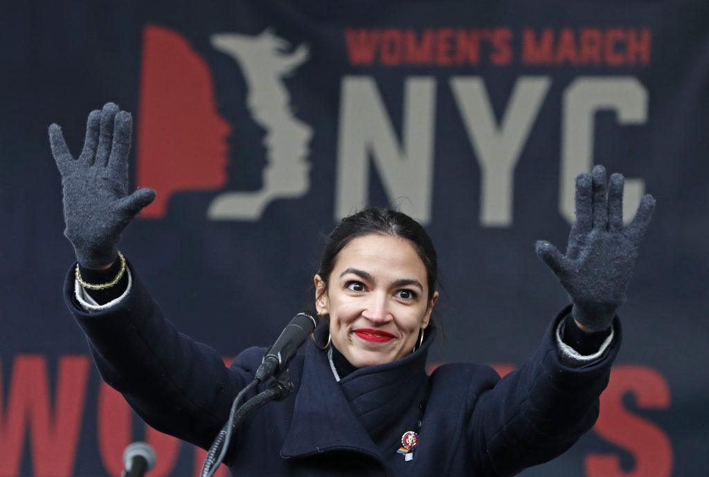 Democrats Liberal Lean In this Jan. 19, 2019, file photo, U.S. Rep. Alexandria Ocasio-Cortez, D-New York, waves to the crowd after speaking at Women's Unity Rally organized by Women's March NYC at Foley Square in Lower Manhattan in New York. On Thursday, Feb. 14, newly-elected Rep. Alexandria Ocasio-Cortez led a chorus of cheers as Amazon announced it was abandoning plans to build a sought-after headquarters in New York City. Activists berated the online giant for a $3 billion package of tax breaks she said the city could better invest in hiring teachers or fixing the subway. (Kathy Willens/AP Photo, File)