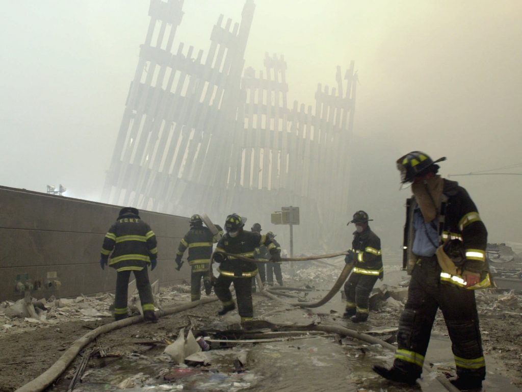 Sept 11 Victim Fund In this Sept. 11, 2001 file photo, with the skeleton of the World Trade Center twin towers in the background, New York City firefighters work amid debris on Cortlandt St. after the terrorist attacks. (Mark Lennihan/AP Photo, File)
