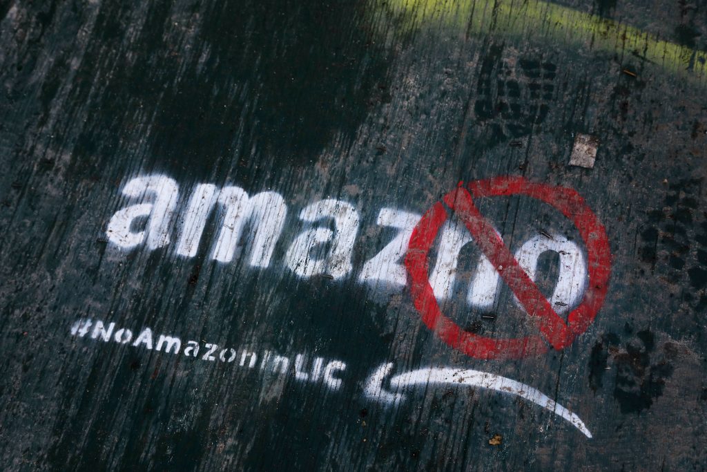 Amazon-HQ-Vanished Deal In this Nov. 16, 2018, file photo graffiti has been painted on a sidewalk by someone opposed to the location of an Amazon headquarters in the Long Island City neighborhood in the Queens borough of New York. Local opposition to the proposed Amazon campus grew quickly with grievances that the deal was done secretively; Amazon didn’t need nearly $3 billion in tax incentives; and rising rents could push people out of the neighborhood. (Mark Lennihan/AP Photo, File)