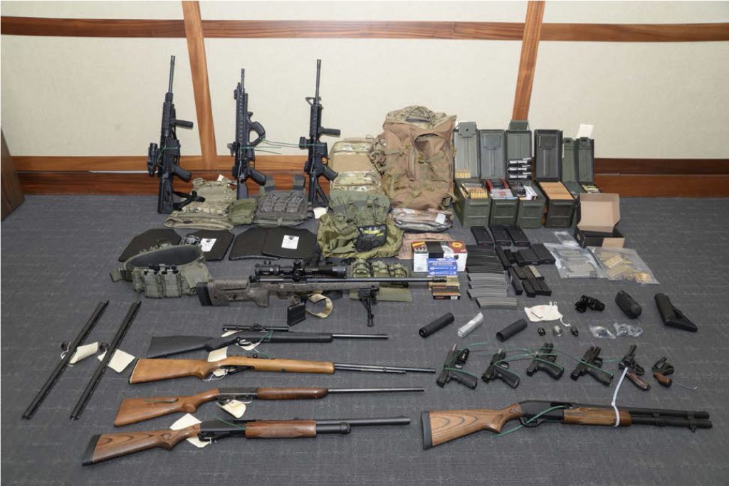 This image provided by the U.S. District Court in Maryland shows firearms and ammunition that figure in the case against Christopher Paul Hasson. Prosecutors say that Hasson, a Coast Guard lieutenant, is a 