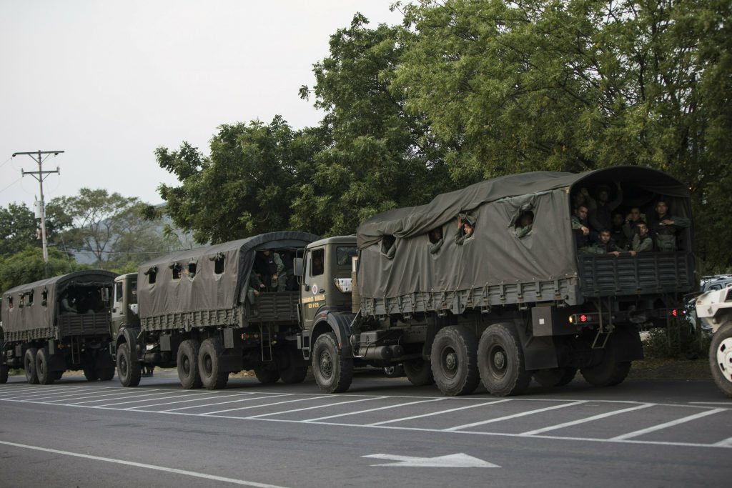 Venezuela Political Crisis Trucks loaded with officers of the Bolivarian National Guard arrive at the entrance of the Tienditas International bridge that connects Venezuela with Colombia, in Urena, Venezuela, Feb. 21, 2019. (Rodrigo Abd/AP Photo)