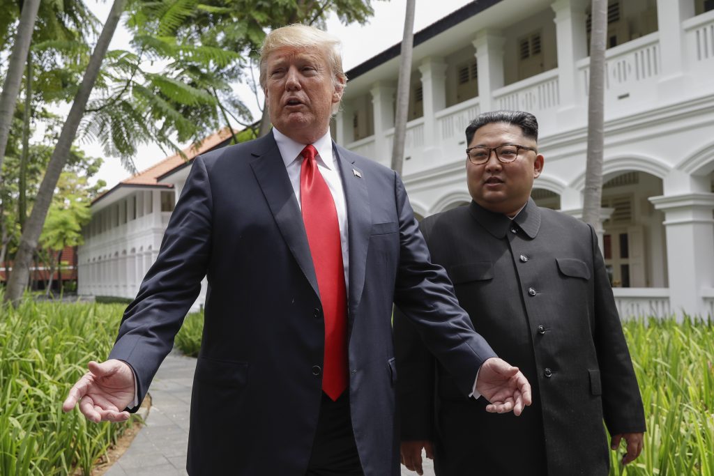 Donald Trump, Kim Jong Un In this June 12, 2018, file photo, President Donald Trump and North Korea leader Kim Jong Un stop to talk with the media as they walk from their lunch at the Capella resort on Sentosa Island in Singapore. (Evan Vucci/AP Photo)