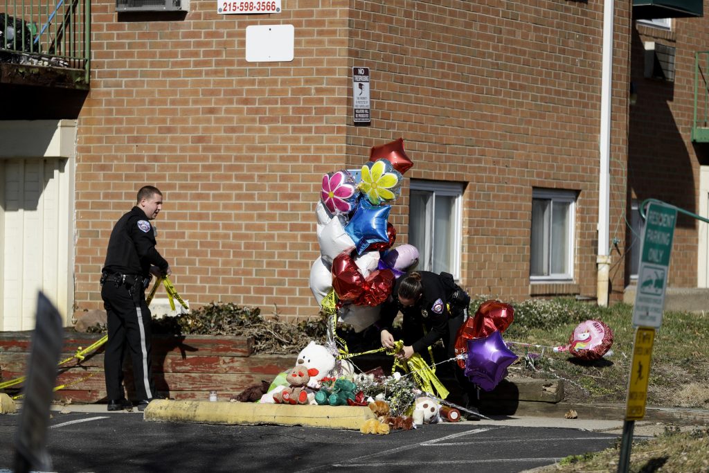 Family Members Killed Police officers remove crime scene tape near a makeshift memorial outside the Robert Morris Apartments, Thursday, Feb. 28, 2019, in Morrisville, Pa. (Matt Slocum/AP Photo)
