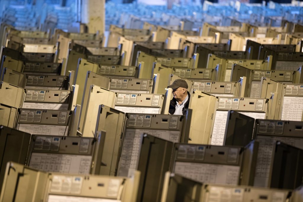 Election Security Reform Report A technician works to prepare voting machines in Philadelphia. (AP Photo/Matt Rourke, File)