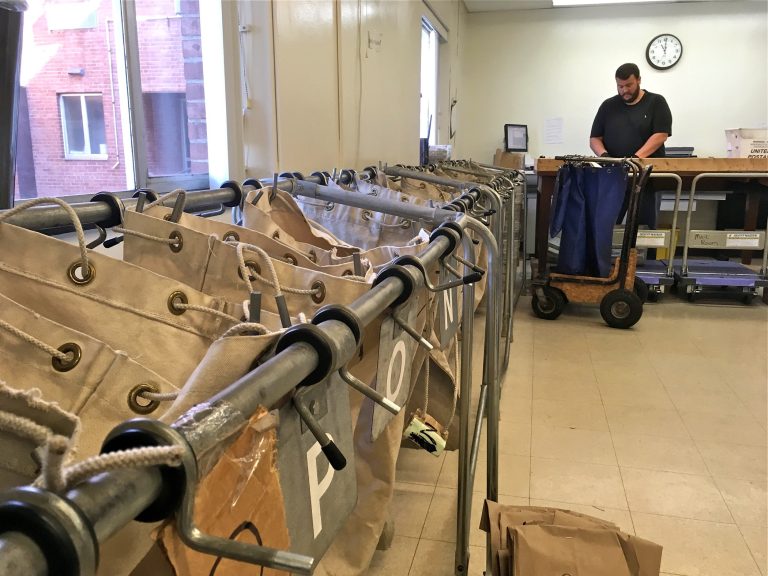 Pennsylvania Corrections Department mail inspector Brian Strawser sorts inmate mail at Camp Hill state prison in Camp Hill, Pa.