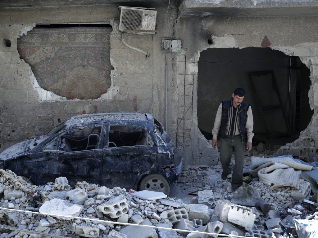 A man walks amid rubble in the Syrian town of Douma in April 2018. A report out Sunday confirmed that a chemical attack early that month was one of hundreds since the start of the Syrian civil war. A man walks amid rubble in the Syrian town of Douma in April 2018. A report out Sunday confirmed that a chemical attack early that month was one of hundreds since the start of the Syrian civil war. (Hassan Ammar/AP Photo)