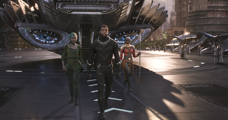 bp3_custom-438f6e2ebe67af7c92292dd73e97b6772d3d382a-s800-c85 Nakia (Lupita Nyong'o), T'Challa (Chadwick Boseman) and Okoye (Danai Gurira) emerge from a Wakandan aircraft in Black Panther. (Marvel Studios)