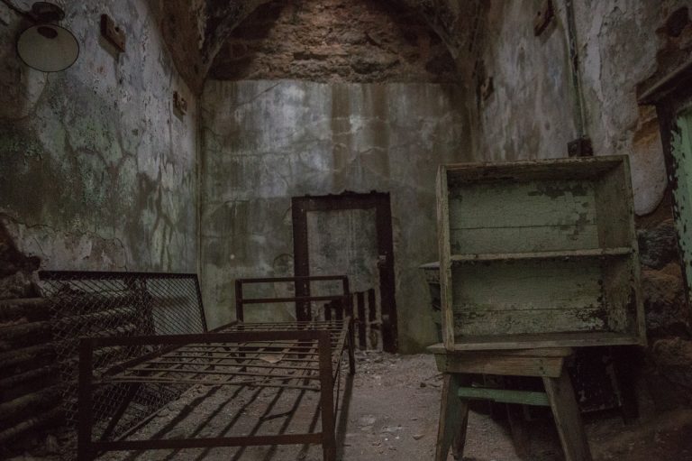 When Eastern State Penitentiary opened in the 1820’s it was considered the the world’s first true penitentiary, a building designed to inspire remorse and regret, says Sean Kelley, Senior Vice President and Director of Interpretation.  The cells were 8 x 12 with a bed and toilet.  People who were incarcerated there were kept in total isolation. (Lindsay Lazarski/WHYY)