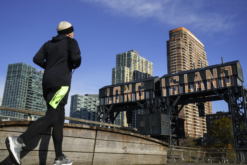 A man runs along the waterfront in the Long Island City neighborhood of the Queens borough of New York City on Nov. 14, 2018. “After much thought and deliberation, we’ve decided not to move forward with our plans to build a headquarters for Amazon in Long Island City, Queens,” Amazon said in a press release. A man runs along the waterfront in Queens on Nov. 14, 2018.