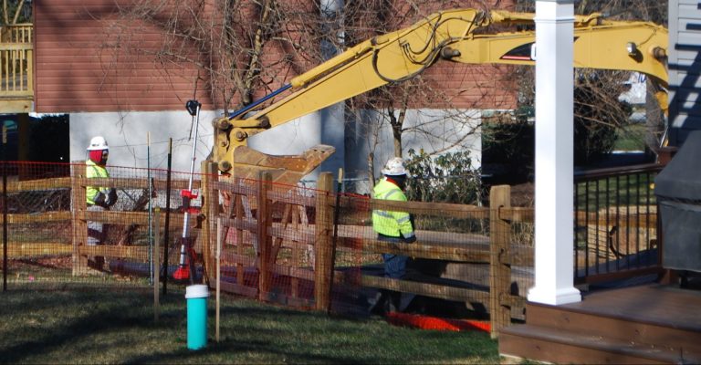 Crews worked on Monday Jan. 21 to stabilize a new sinkhole that opened up at Lisa Drive, a suburban development in West Whiteland Township, Chester County where Sunoco operates its Mariner East pipelines. (Jon Hurdle/StateImpact Pennsylvania)