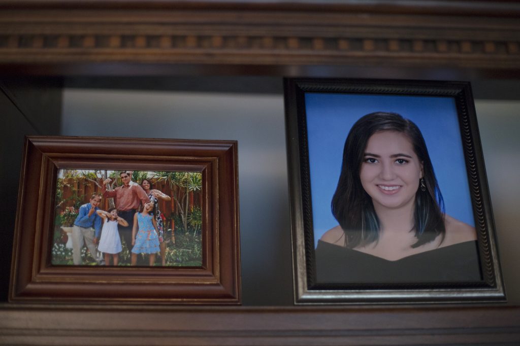 Photos of the Schentrup family and their daughter Carmen fill the living room of the family's new home. Carmen died one week shy of her 17th birthday. Alyse Young for NPR
