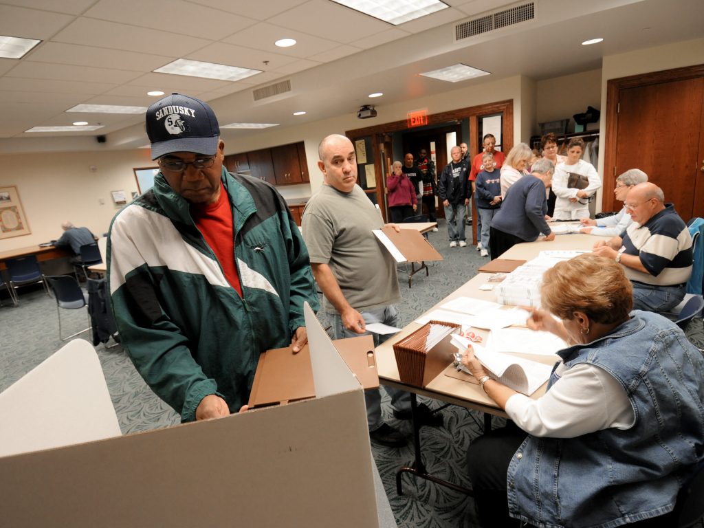 Commissioners in Sandusky, Ohio, have voted to make Election Day a city holiday, in place of Columbus Day. Sandusky resident Moses Croom is seen here voting at a polling station at a local library in November 2008. Commissioners in Sandusky, Ohio, have voted to make Election Day a city holiday, in place of Columbus Day. Sandusky resident Moses Croom is seen here voting at a polling station at a local library in November 2008.
(Jason Werling/Sandusky Register)