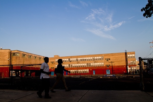 Students head to school at the now-shuttered Germantown High School. (Brad Larrison for WHYY)