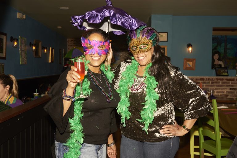 Marki and Deenee Levere celebrate Fat Tuesday at Acadia Bar in South Philadelphia. (Natalie Piserchio for WHYY)