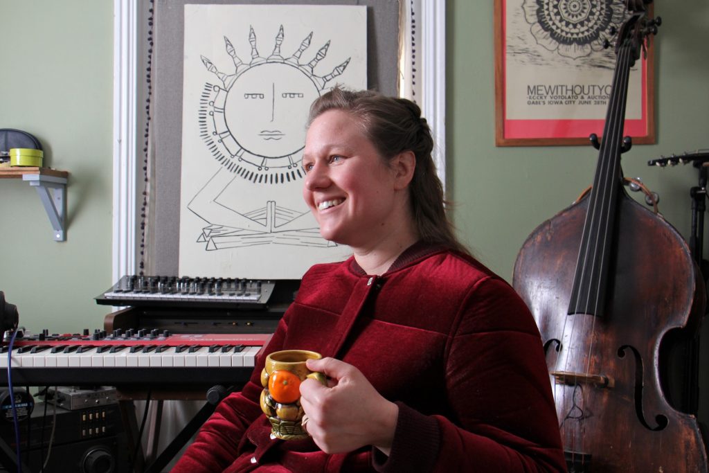 Philadelphia singer-songwriter Birdie Busch at her home studio in Germantown. Busch wrote eight original songs inspired by the art of women in the collection of the Philadelphia Museum of Art, and will perform them Friday night at the museum. (Emma Lee/WHYY)
