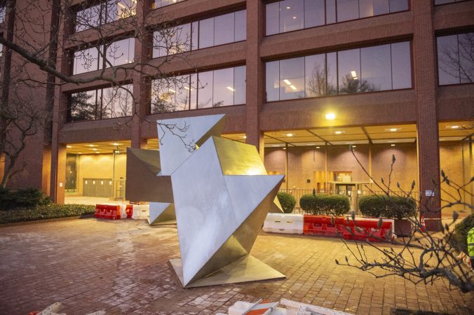 White Water, a sculpture by Philadelphia artist Robinson Fredenthal is moved from the garden behind the Wells Fargo building in Old City to its new home at the Woodmere Art Museum in Chestnut Hill. (Jonathan Wilson for WHYY)