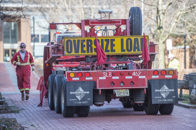 A 90 foot flat bed truck back into into place. White Water, a sculpture by Philadelphia artist Robinson Fredenthal is moved from the garden behind the Wells Fargo building in Old City to its new home at the Woodmere Art Museum in Chestnut Hill. (Jonathan Wilson for WHYY)