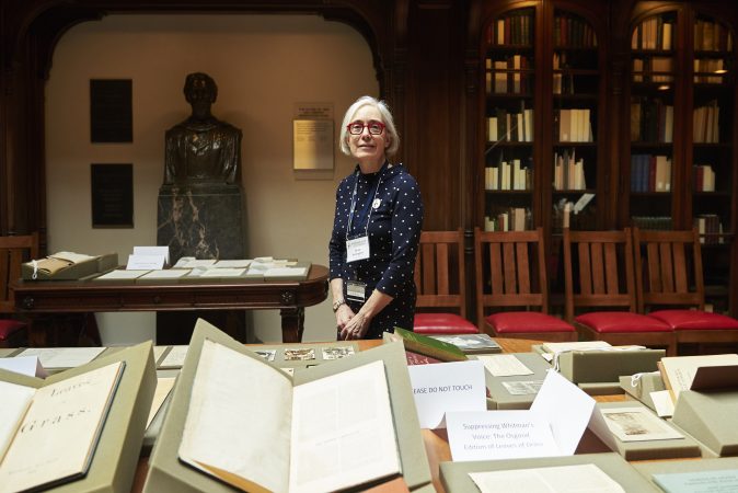 Lynne Farrington, Project Director of Whitman at 200, stands amongst the Whitman pop-up exhibition at the Class of 1978 Orrery Pavilion, Van Pelt-Dietrich Library. (Natalie Piserchio for WHYY)