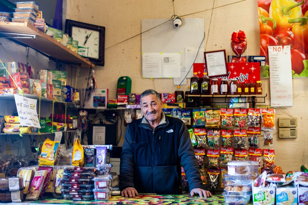 2019 3 26- b larrison- philadelphia- impact services providing money for new small business development in kensington-3 Abdelmgeed Muhammad Elgamal inside of his produce market on Allegheny Avenue in Kensington Tuesday. (Brad Larrison for WHYY)