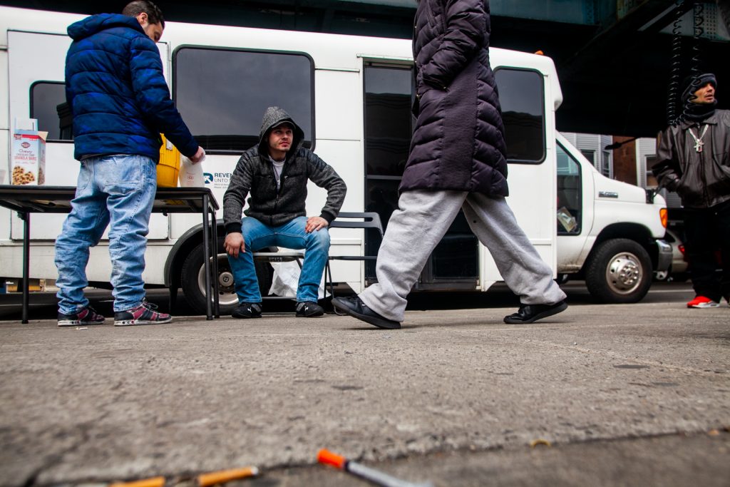 2019 3 8- b larrison- philadelphia- dr ben cocchiaro provides harm reduction care from prevention point bus -3 Louis Morano, who was visiting the Prevention Point bus for the second time, sits outside and waits to be seen by Dr. Ben Cocchiaro. (Brad Larrison for WHYY)