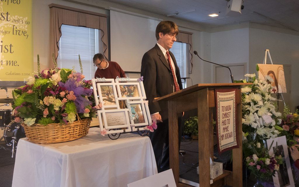 Dismembered Teen’s Life Marc Davis, associate pastor of the New Life Presbyterian Church looks over arrangements inside the sanctuary before a memorial service for Grace Packer, the local teen who authorities say was killed and dismembered by her adoptive mother and her boyfriend, Monday, Jan. 16, 2017, in Glenside, Pa. (Ed Hille/The Philadelphia Inquirer via AP)