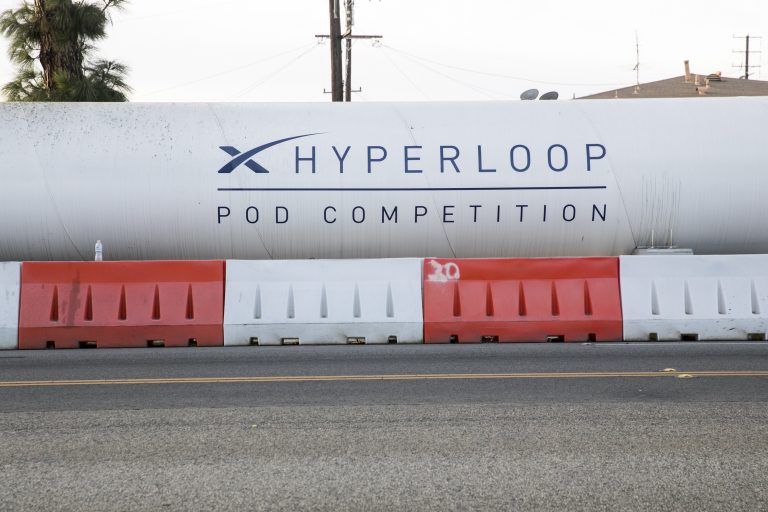 AP_17348276728896-768×512 A logo sign on a Hyperloop test track outside of the headquarters of Space Exploration Technologies Corp., also known as SpaceX, in Hawthorne, California, on December 10, 2017. (Kristoffer Tripplaar/Sipa USA via AP Images)