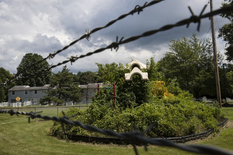 Last summer, weeds engulf a playground at housing section of the former Naval Air Warfare Center Warminster in Warminster, Pa. In Warminster and surrounding towns in eastern Pennsylvania, and at other sites around the United States, the foams once used routinely in firefighting training at military bases contained per-and polyfluoroalkyl substances, or PFAS. EPA testing between 2013 and 2015 found significant amounts of PFAS in public water supplies in 33 U.S. states. (Matt Rourke/AP Photo)
