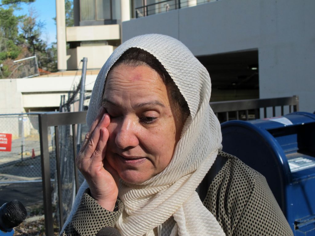Shamim Rahman, the mother of Adnan Syed, wipes away a tear outside the Maryland Court of Appeals on Thursday, Nov. 29, 2018, in Annapolis, Md., after attending arguments in Maryland's highest court reviewing a decision that could reinstate Syed's conviction for the slaying of his high school sweetheart. The high-profile case was chronicled in the hit 