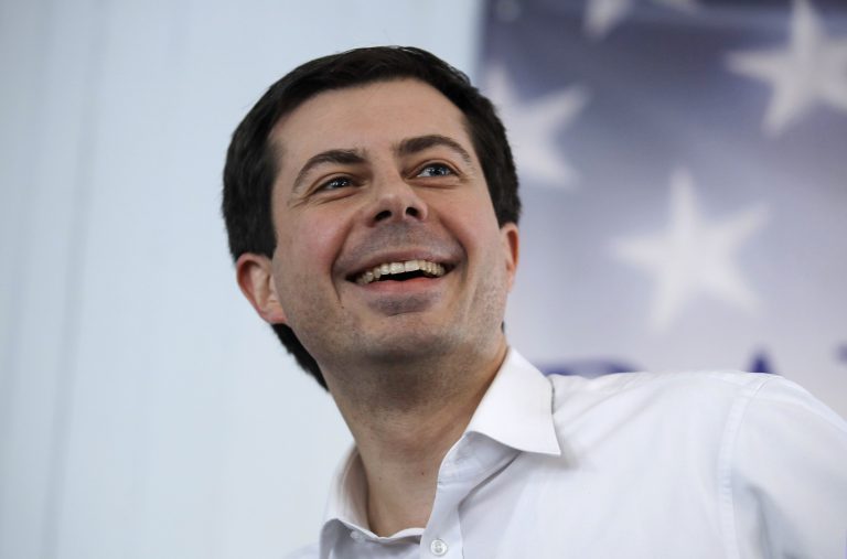 Mayor Pete Buttigieg, of South Bend, Indiana, smiles as he listens to a question during a stop in Raymond, N.H., Saturday, Feb. 16, 2019. Buttigieg is weighing a run in the 2020 presidential race. (AP Photo/Charles Krupa)