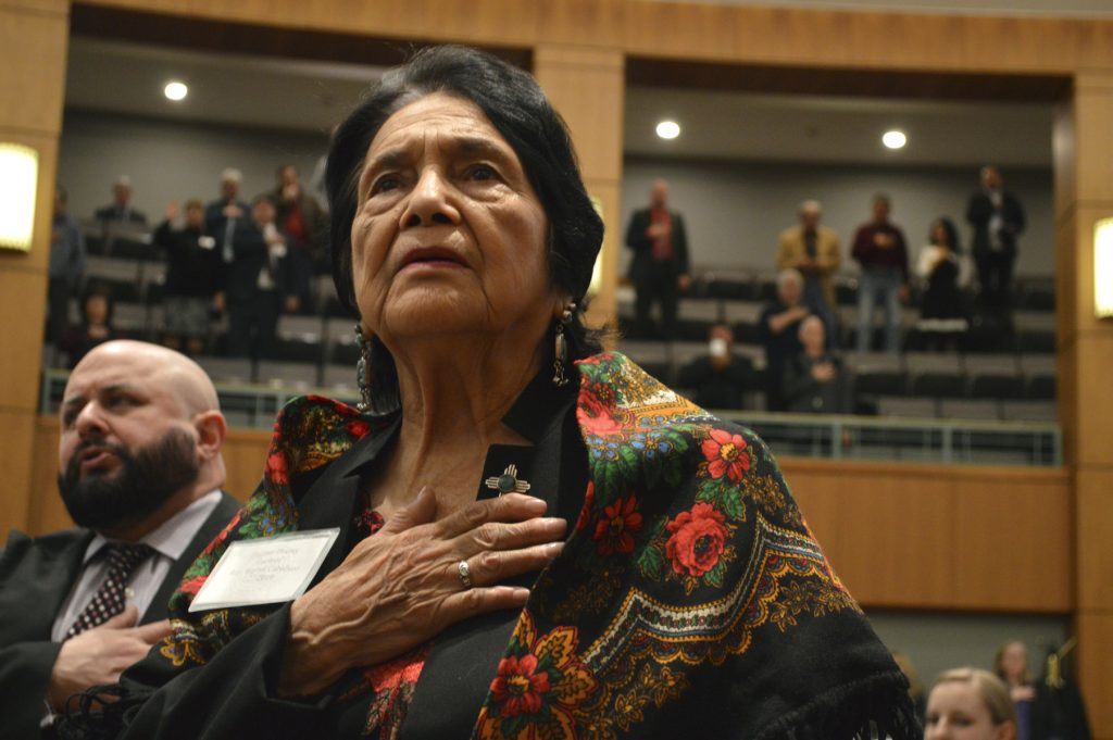 Dolores Huerta, 88, the Mexican-American social activist who formed a farmworkers union with Cesar Chavez, stands for the Pledge of Allegiance in Spanish while visiting the New Mexico Statehouse on Wednesday, Feb. 27, 2019. The New Mexico-born Huerta was honored by the House for 