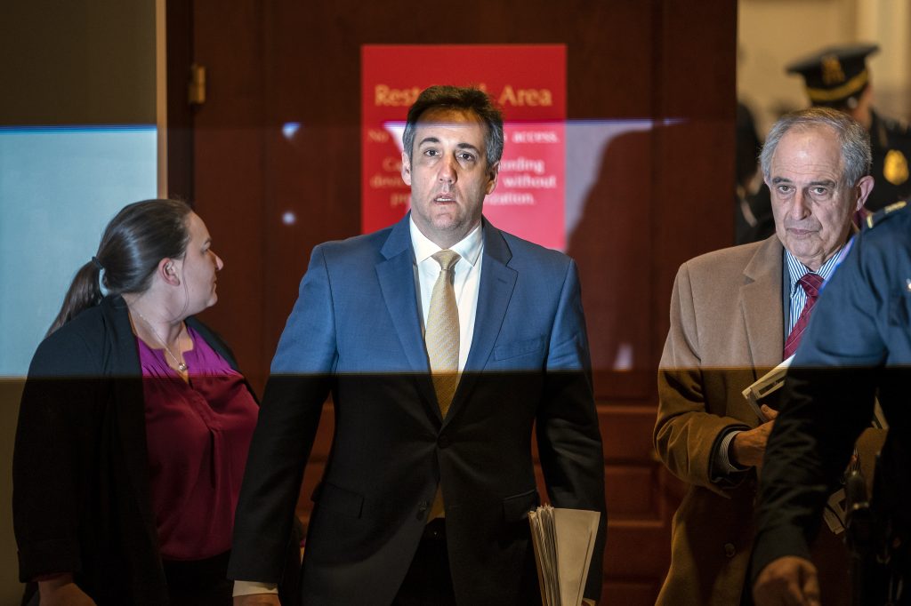 Michael Cohen, Lanny Davis Michael Cohen, President Donald Trump's former lawyer, is illuminated by a camera flash as he leaves a closed-door interview with his attorney Lanny Davis, (right), after testifying before the House Intelligence Committee, on Capitol Hill in Washington, Thursday, Feb. 28, 2019. (J. Scott Applewhite/AP Photo)