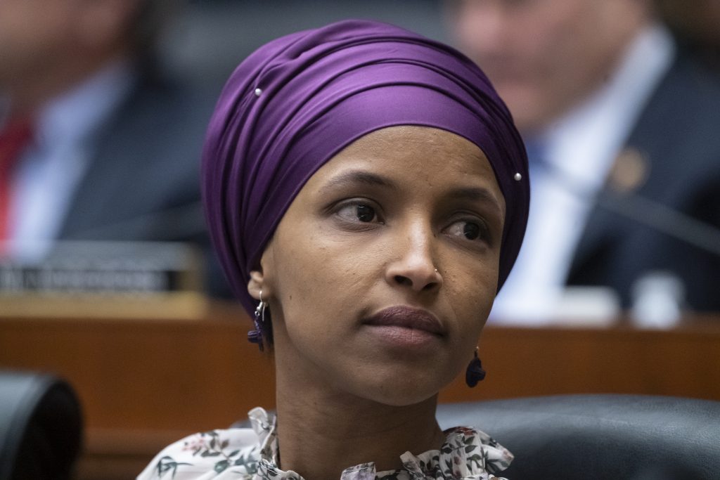 Ilhan Omar Rep. Ilhan Omar, D-Minn., sits with fellow Democrats on the House Education and Labor Committee during a bill markup, on Capitol Hill in Washington, Wednesday, March 6, 2019. (AP Photo/J. Scott Applewhite)