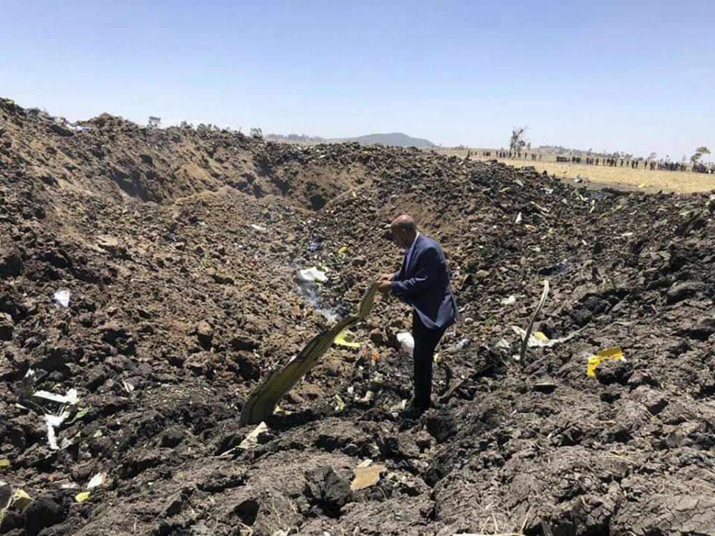 Ethiopia Plane Crash In this photo taken from the Ethiopian Airlines Facebook page, the CEO of Ethiopian Airlines, Tewolde Gebremariam, looks at the wreckage of the plane that crashed shortly after takeoff from Addis Ababa, Ethiopia, Sunday March 10, 2019. An Ethiopian Airlines flight crashed shortly after takeoff from Ethiopia's capital on Sunday morning, killing all 157 people thought to be on board, the airline and state broadcaster said, as anxious families rushed to airports in Addis Ababa and the destination, Nairobi. (Facebook via AP)