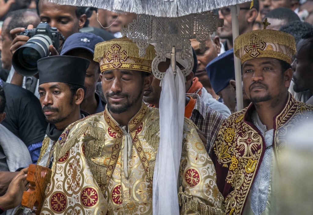 APTOPIX Ethiopia Plane Crash A priest cries at a mass funeral at the Holy Trinity Cathedral in Addis Ababa, Ethiopia Sunday, March 17, 2019. Thousands of Ethiopians have turned out to a mass funeral ceremony in the capital one week after the Ethiopian Airlines plane crash. (Mulugeta Ayene/AP Photo)